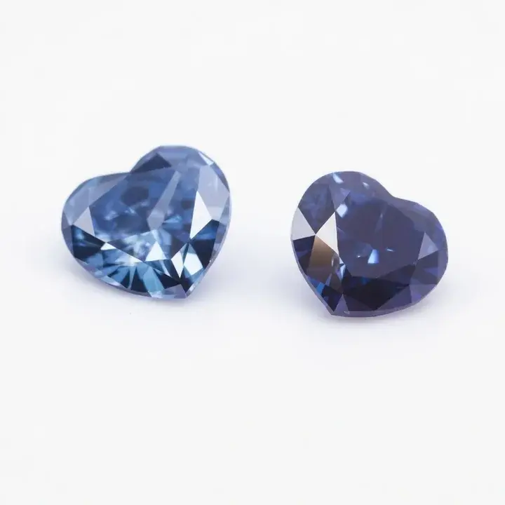 Two heart-shaped diamonds on a pale background